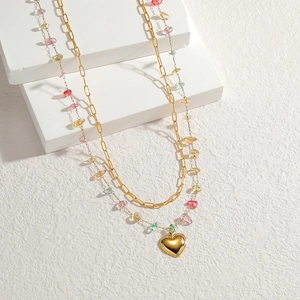 Double-layered gold necklace with colorful natural stone chips and heart pendant