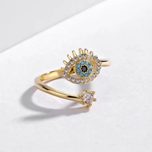 Adjustable gold evil eye ring featuring blue stones and sparkling zircon accents