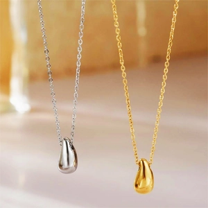 Polished gold and silver teardrop pendant necklaces on minimalist link chains