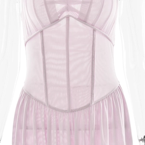 Detail of light pink mesh corset dress with boning structure and pleated skirt texture