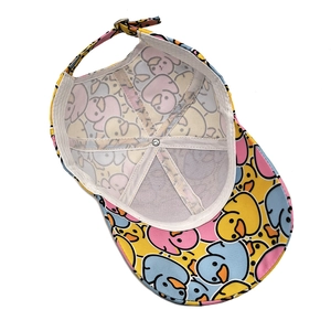 Detail of adjustable metal buckle and cartoon duck print on internal baseball cap seams