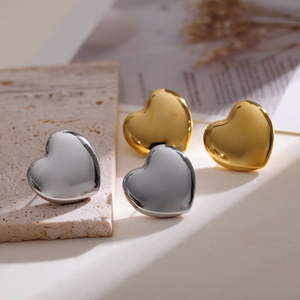 Minimalist 3D heart stud earrings in polished gold and silver stainless steel