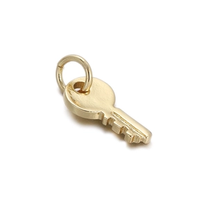 Detailed close-up of a minimalist 18K gold-plated key pendant for jewelry making
