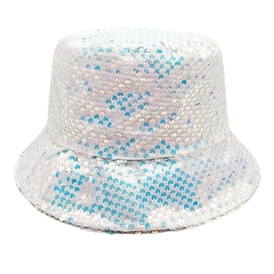 Close-up of sparkling white and blue sequins on a stylish reversible bucket hat surface
