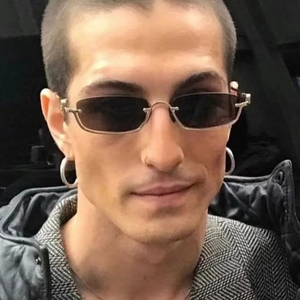 Close-up of stylish rectangular semi-rimless silver sunglasses with dark grey lenses