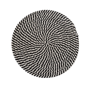 Close-up of circular woven placemat with black and white spiral textured cotton rope
