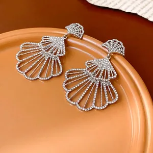 Elegant silver fan-shaped hollow drop earrings with shimmering crystals for women