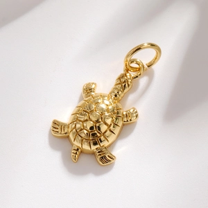Exquisite golden turtle pendant with intricate shell textures and sparkling diamond accents