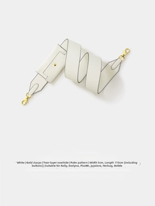 Close-up of white palm pattern leather strap with gold hardware and small coin pouch