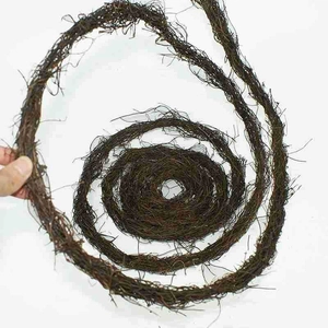 Close-up of natural dark brown plant vine coil showing textured dried vegetable fiber