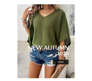 Gros plan sur un pull en maille vert herbe avec col en V et texture ajourée chic