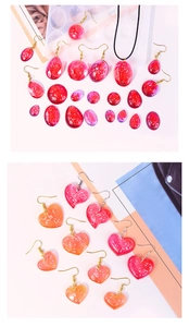 Detailed view of DIY resin heart and star pendants made from silicone jewelry molds