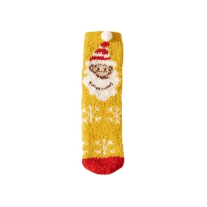 Yellow coral fleece Christmas sock with Santa pattern and white pompom on white background