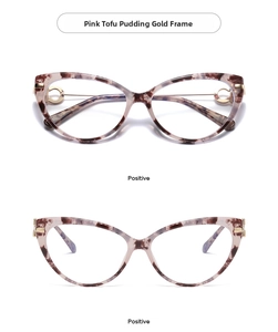 Detail of pink marble pattern cat-eye glasses with gold metal temples and frames