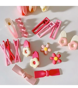 Flat lay of pink Y2K hair clips set featuring resin hearts flowers and bows