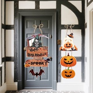 Detail of wooden Halloween door signs featuring pumpkins, bats, and ghosts with jute ropes