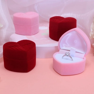 Romantic heart-shaped velvet ring box in red and pink colors for wedding jewelry storage