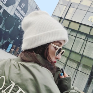 White rabbit fur knit beanie for women in casual street style with soft warm texture