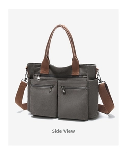 Seitenansicht der Multi-Pocket-Canvas-Tasche mit braunen Trägern und Metallreißverschlüssen