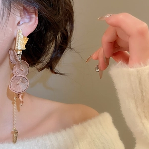 Detail of long floral drop earrings with pink chiffon petals and marble stone pendants