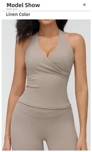 Detailed view of linen yoga top featuring V-neck halter design and ruched details