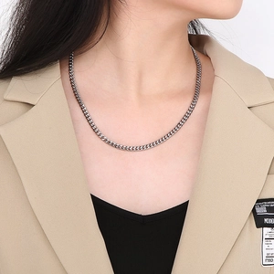 Polished silver stainless steel Cuban link necklace for men and women on a model