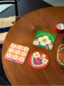 Detail of colorful diatom mud heat-resistant coasters with floral and rainbow designs
