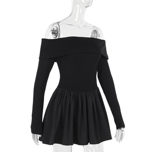 Detail of off-shoulder black mini dress featuring long sleeves and pleated A-line skirt