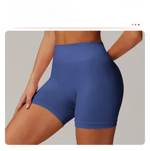 Detail of high-waist seamless yoga shorts with blue jacquard texture and lifting effect