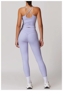 Rear view of lavender cross-back yoga tank top with matching high-waisted leggings