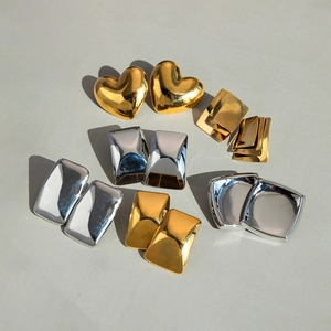 Minimalist 18K gold and silver geometric earrings with rectangular and heart designs