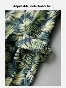 Detail of adjustable and detachable waist belt on palm leaf print bathrobe