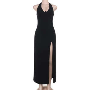 Detail view of black halter neck maxi dress with deep V-neckline and high side slit