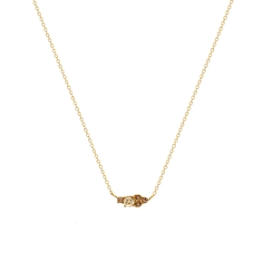 Close-up of gold chain necklace with central champagne stone and amber crystal accents