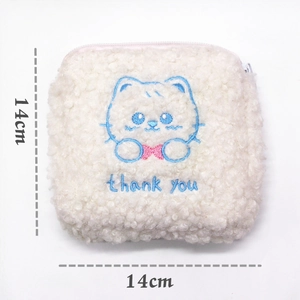 Detailed view of cat embroidery on a white fleece pouch showing 14cm dimensions