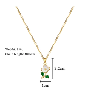 Detail showing flower pendant dimensions and green leaf enamel work on a steel chain