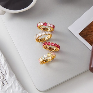 Set of four gold-plated stainless steel eternity rings with colorful zircon inlay