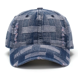 Distressed vintage denim baseball cap featuring woven pattern and frayed denim details