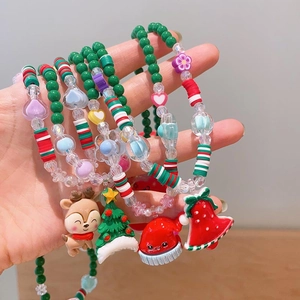 Handmade beaded Christmas jewelry set with reindeer and tree charms for girls