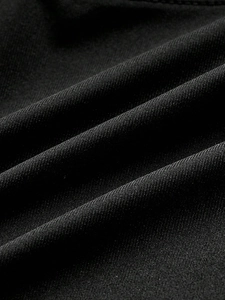Slim fit black tank top featuring cross strap metal buckle design and knit texture