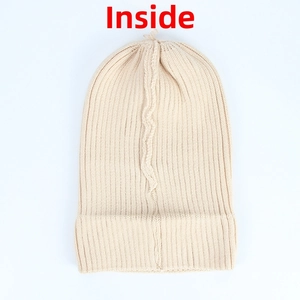 Detailed internal view showing the soft beige ribbed knit fabric and texture of the hat