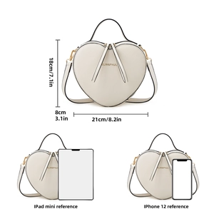 Size comparison of heart-shaped handbag with dimensions, iPad mini, and iPhone