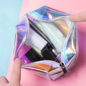 Macro shot of spacious holographic TPU makeup bag with smooth silver zipper and interior space