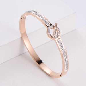 Minimalist rose gold asteroid bracelet with cubic zirconia and Q letter clasp