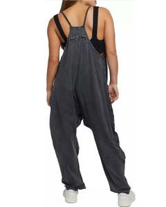 Detail view of charcoal grey cotton overalls featuring back zipper pocket and loose fit