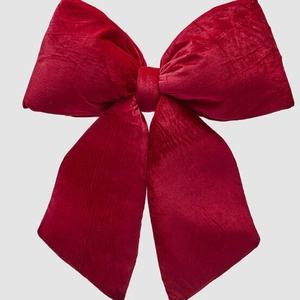 Large burgundy velvet Christmas bow decoration for holiday wreaths and shop window displays