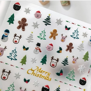 3D relief Christmas nail stickers featuring gingerbread men, reindeer, and festive patterns