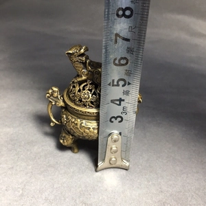 Detailed view of mini copper incense burner with height measurement showing 8cm scale