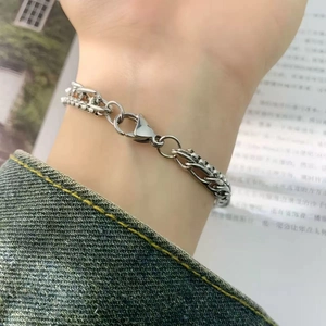 Minimalist double layer silver link chain bracelet with lobster clasp on male model