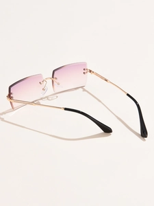 Close-up of rimless square sunglasses with purple gradient lenses and gold metal temples